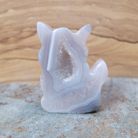 A charming Agate Druzy Cat Figurine, showcasing stunning agate formations with vibrant colors and shimmering crystalline textures, displayed against a soft, neutral background. This delightful piece symbolizes independence and creativity, making it an enchanting decorative item.