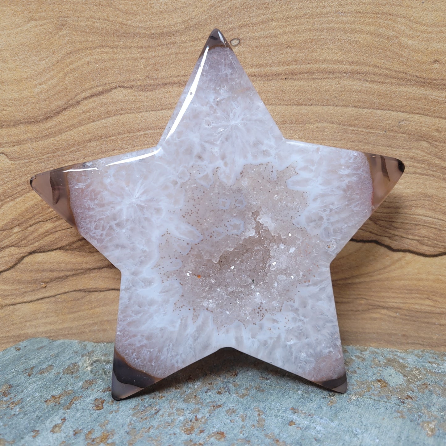  A stunning collection of Agate Druze Stars, featuring rich colors and shimmering crystalline textures, displayed against a soft, neutral background. These unique star-shaped pieces symbolize hope, creativity, and emotional balance, making them enchanting decorative items.