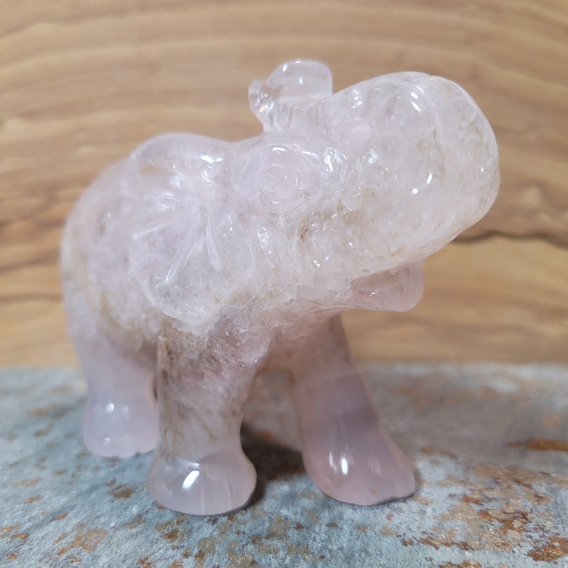 A beautifully carved Agate Quartz Elephant Figurine, showcasing intricate patterns of agate and the natural translucence of quartz, displayed against a soft, neutral background. This charming piece symbolizes wisdom, strength, and emotional balance, making it an appealing decorative item.