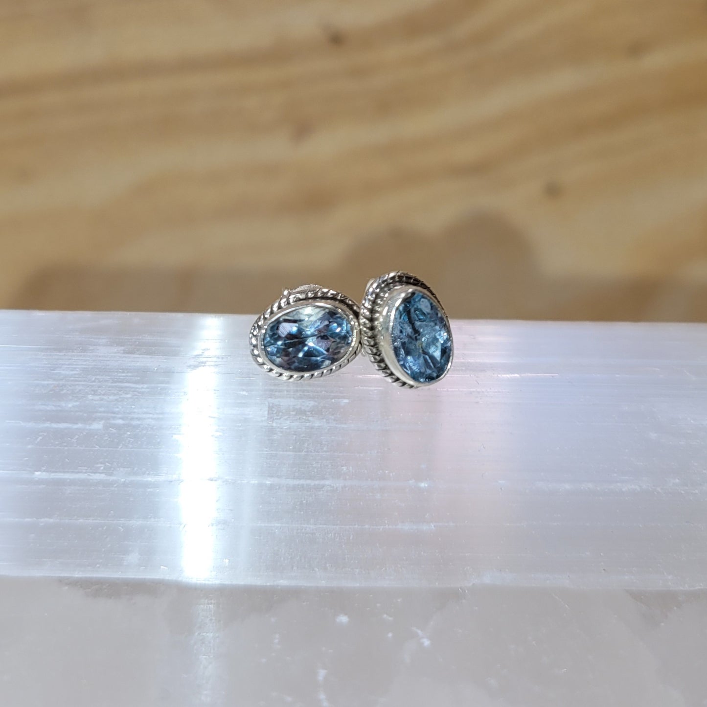 Blue topaz sterling silver earrings featuring radiant blue gemstones set in elegant silver settings.