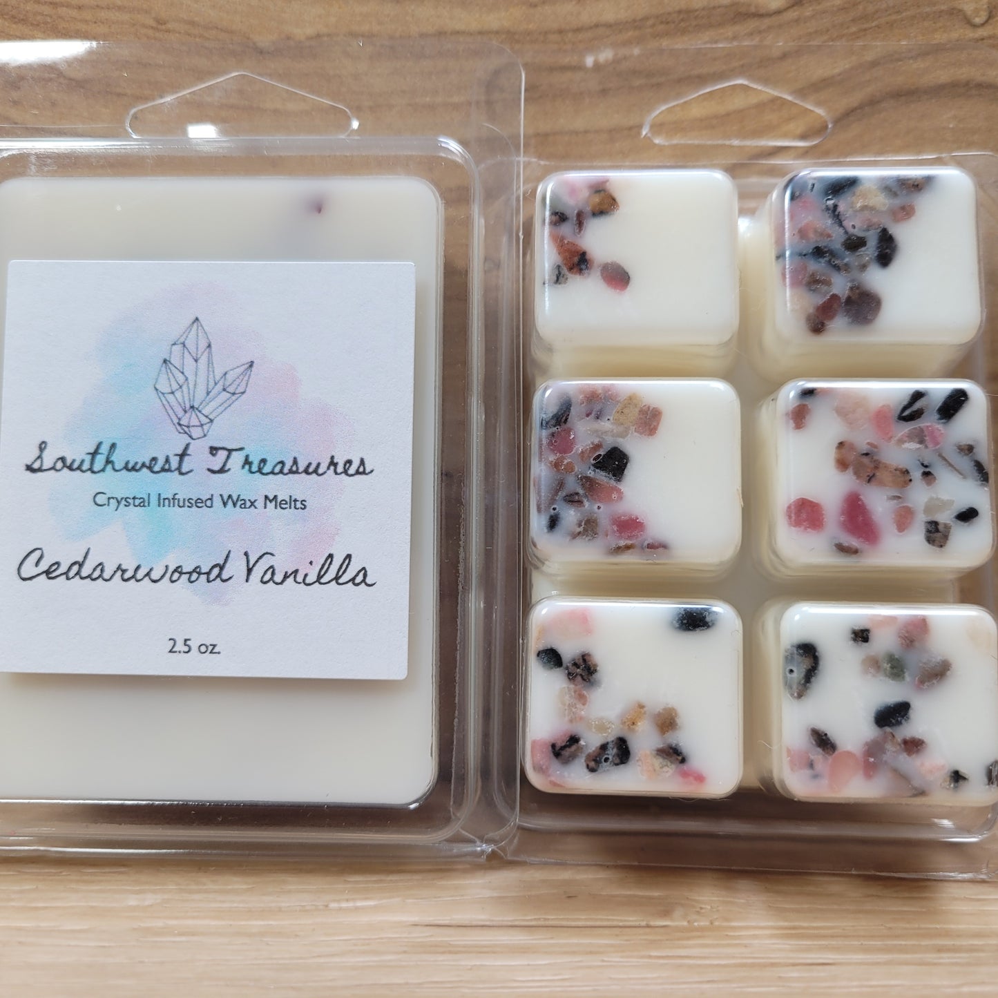 Soy wax melt infused with crystals, featuring a blend of cedarwood and vanilla scents. The wax is designed to provide a warm, inviting aroma and subtle energy benefits when melted in a wax warmer.