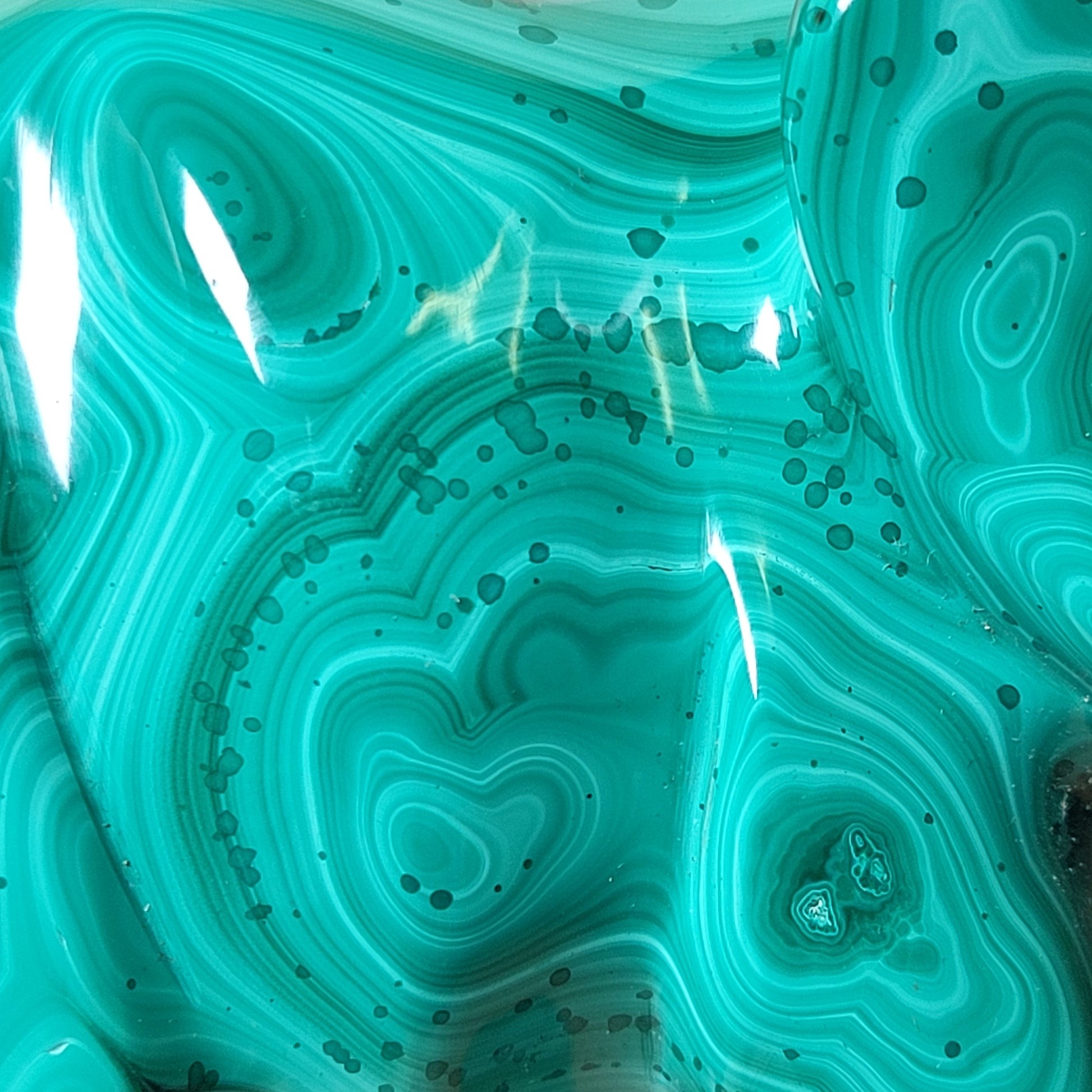 Close-up of a malachite stone with swirl patterns