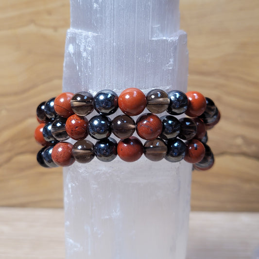 Close-up of a 8mm bracelet featuring polished beads in deep, empowering hues, highlighting the 'Strength SWT Creation' design with its bold and resilient appearance