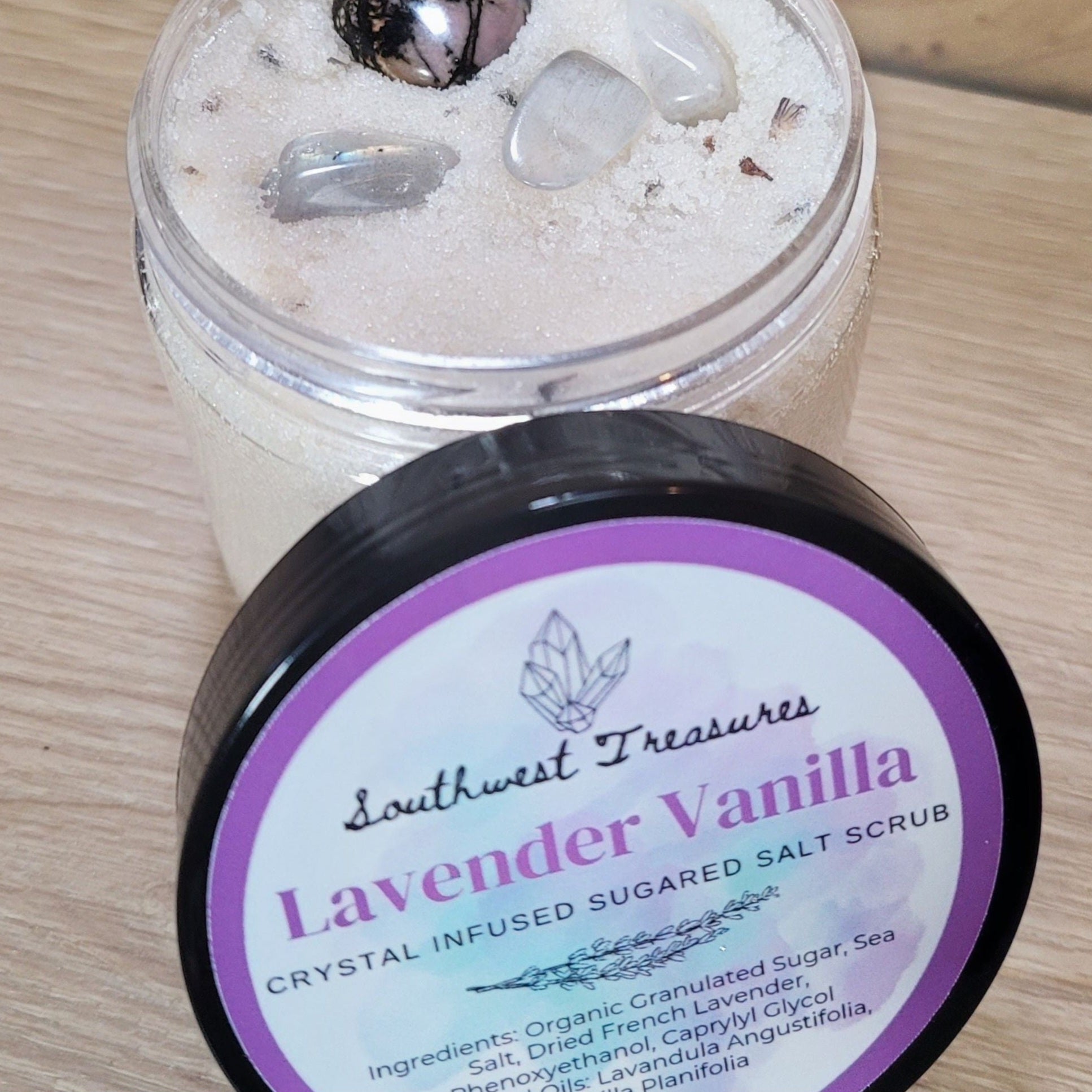 Lavender Vanilla Crystal-Infused Sugared Salt Scrub – Indulge in this luxurious scrub featuring the soothing scents of lavender and vanilla, combined with the exfoliating benefits of sugar and salt. Infused with crystals, it offers calming and balancing properties while providing a gentle exfoliation. Perfect for a relaxing self-care ritual, this scrub enhances your skincare routine with aromatic therapy and the unique energy of crystals for a rejuvenating experience.